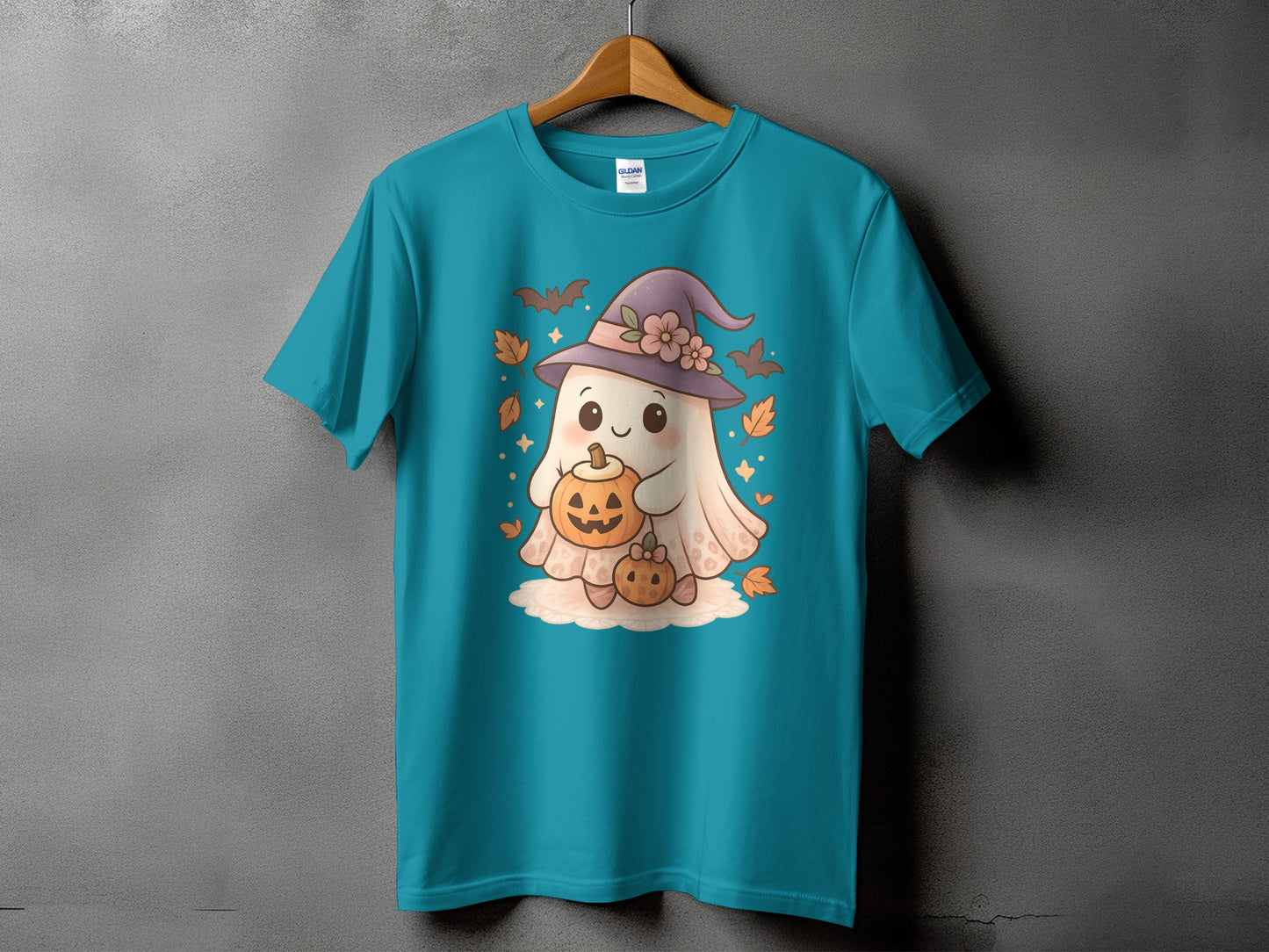 Teal t-shirt with cute ghost holding pumpkins and wearing a witch hat.