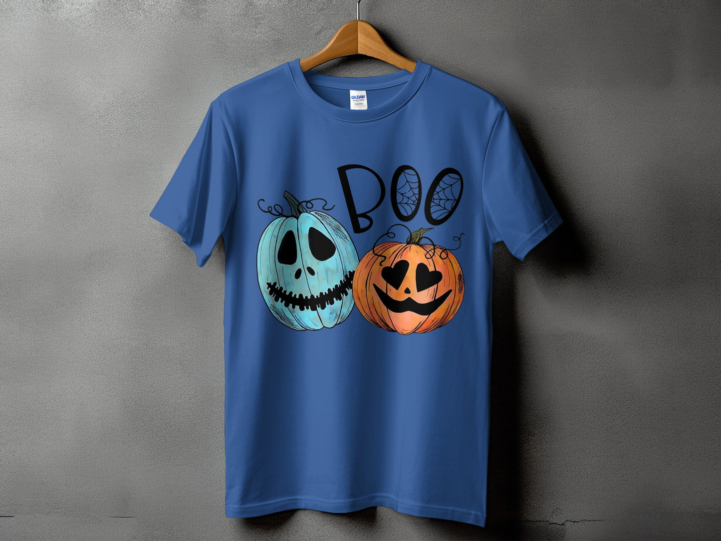 Blue t-shirt with a "Boo" graphic featuring two cartoon pumpkins.