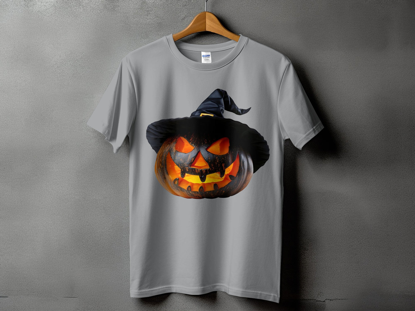 Grey t-shirt with a glowing jack-o'-lantern wearing a black witch hat.