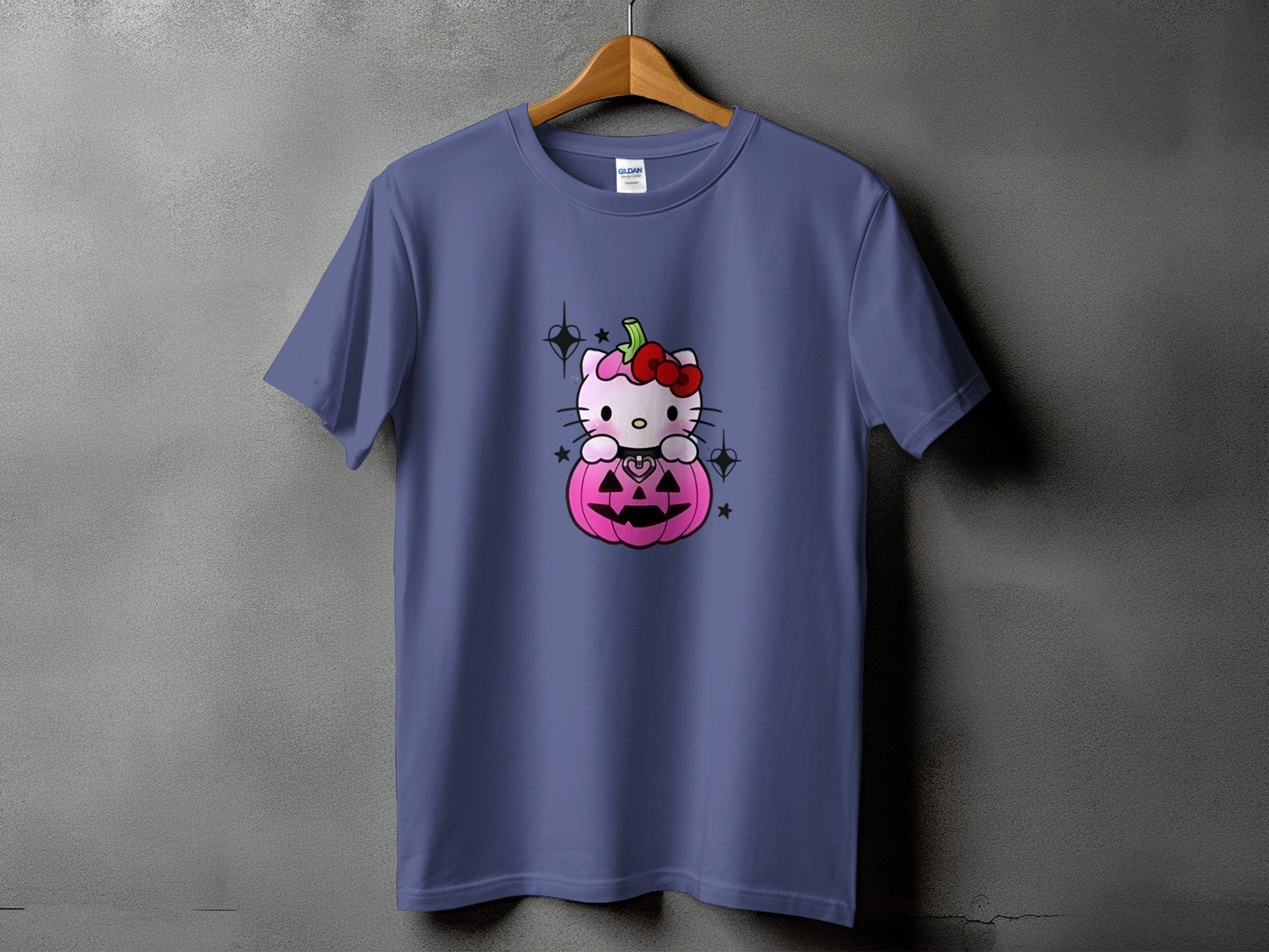 Purple t-shirt with a Hello Kitty Halloween graphic on a pink pumpkin.