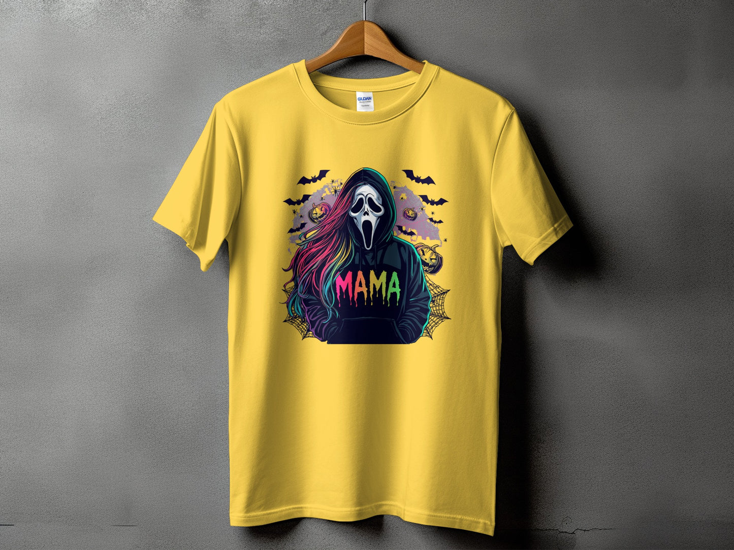 Yellow t-shirt with a Halloween graphic of a ghost face and the word "MAMA".