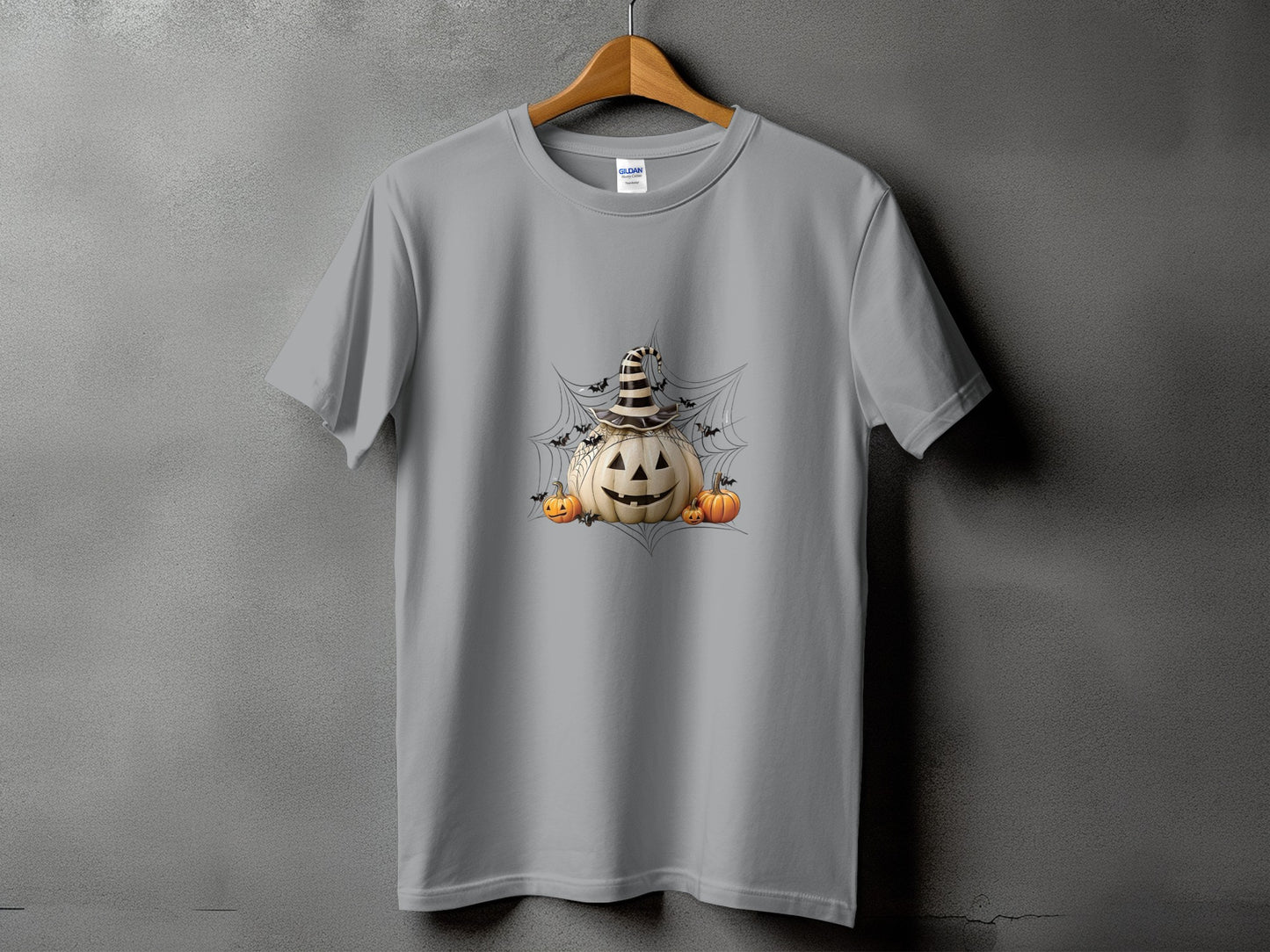 Grey t-shirt with Halloween pumpkins, bats, and witch hat graphic design.