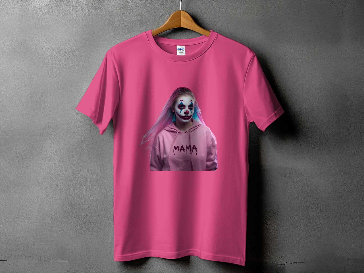 Pink t-shirt with a printed graphic of a person with clown makeup and the word "MAMA".
