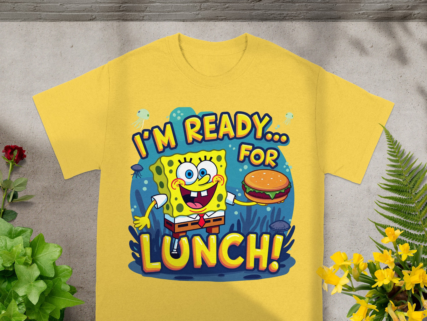 SpongeBob SquarePants with a burger on a yellow t-shirt that says "I'm Ready... For Lunch!"
