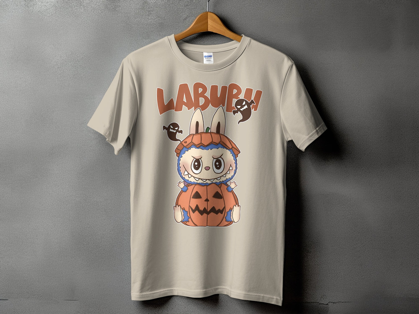 Light tan t-shirt with Labubu character in pumpkin costume and ghosts.