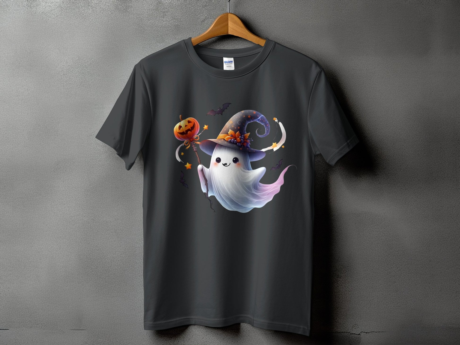 Cute ghost with witch hat holding a pumpkin, on a dark grey t-shirt.