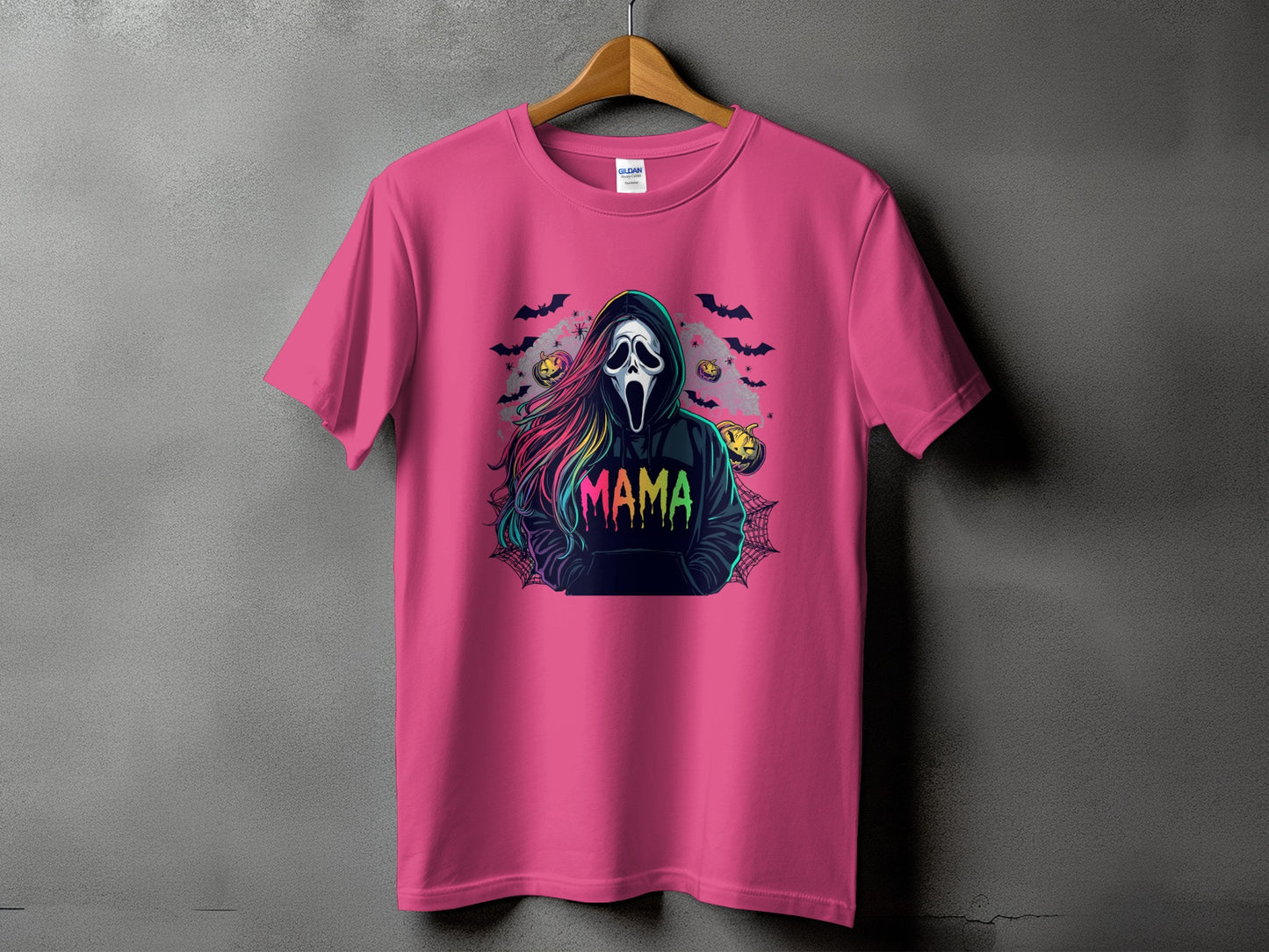 Pink t-shirt with a graphic of a Ghostface mask and "MAMA" in colorful letters.