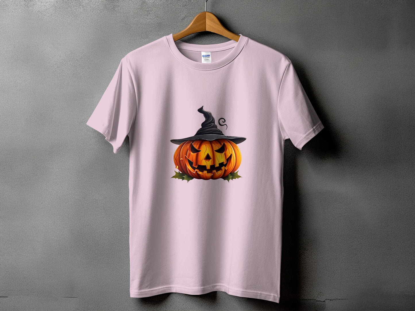 Pink t-shirt featuring a carved jack-o'-lantern wearing a witch hat.