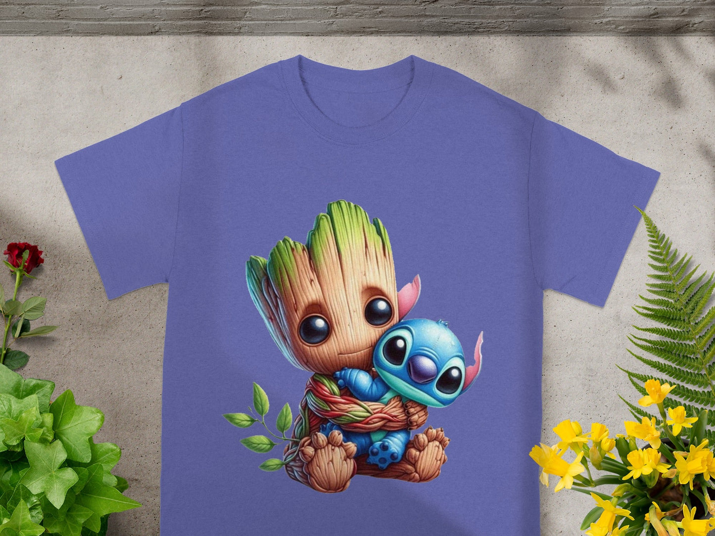 Groot hugging Stitch, design on a purple t-shirt.