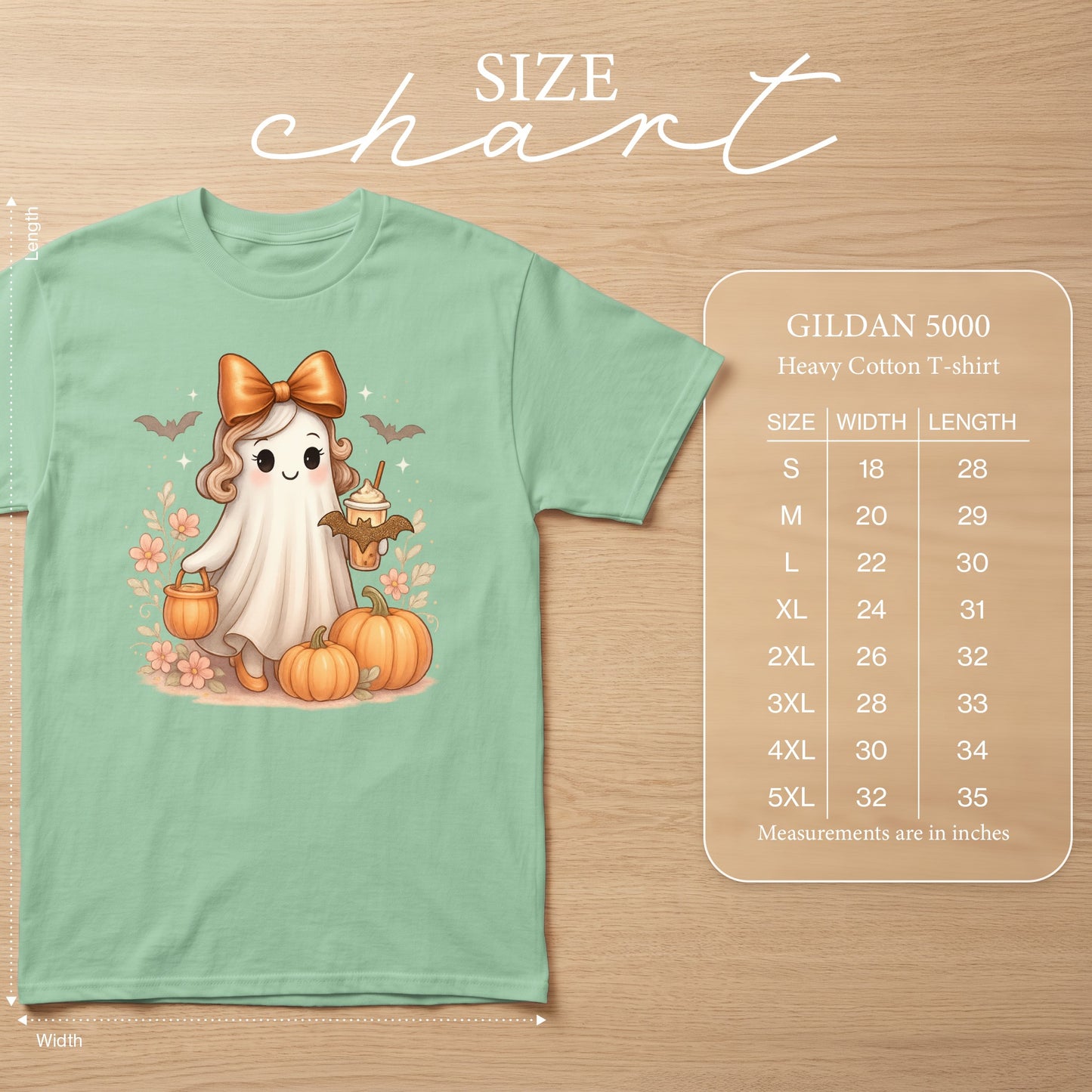 Mint t-shirt with a cute ghost, pumpkins, and a size chart.