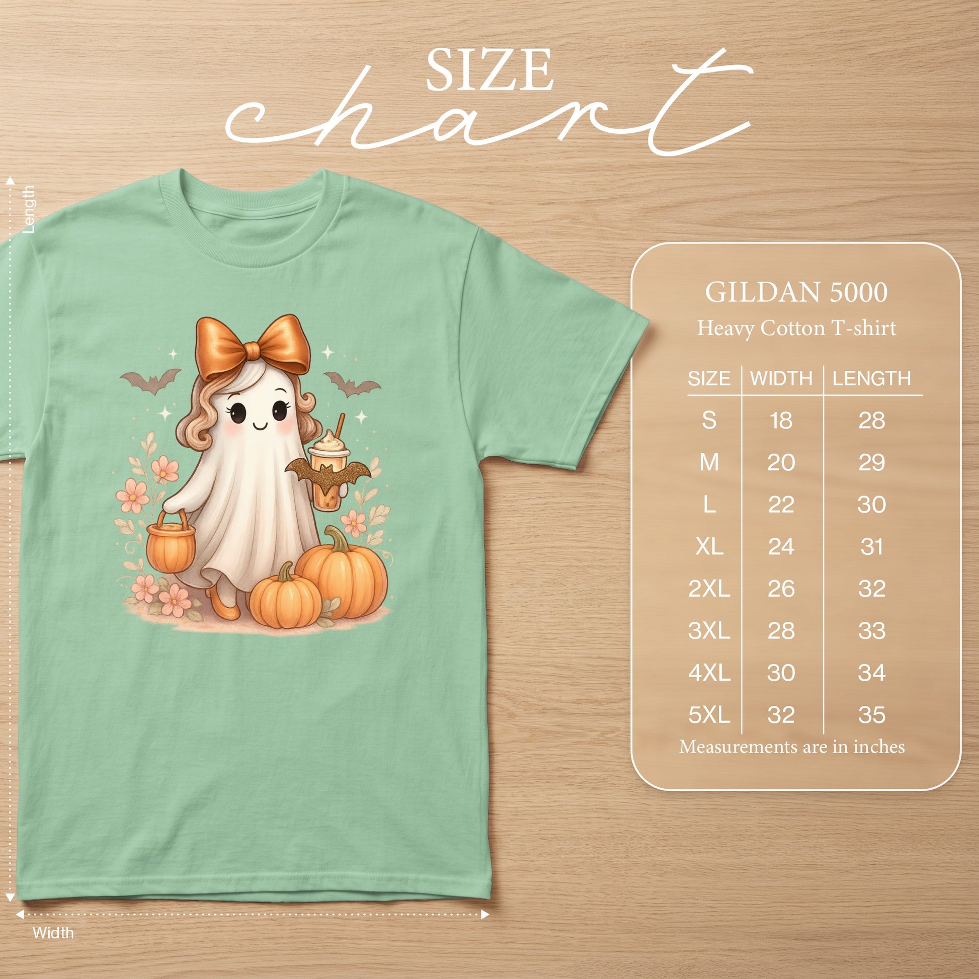 Mint t-shirt with a cute ghost, pumpkins, and a size chart.