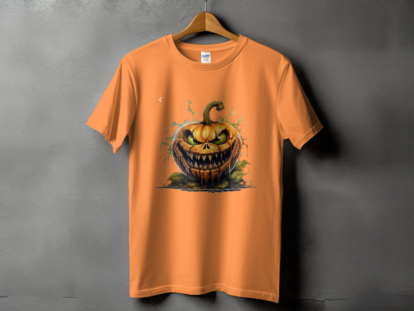 Orange t-shirt with a detailed, scary Jack-o-lantern graphic.