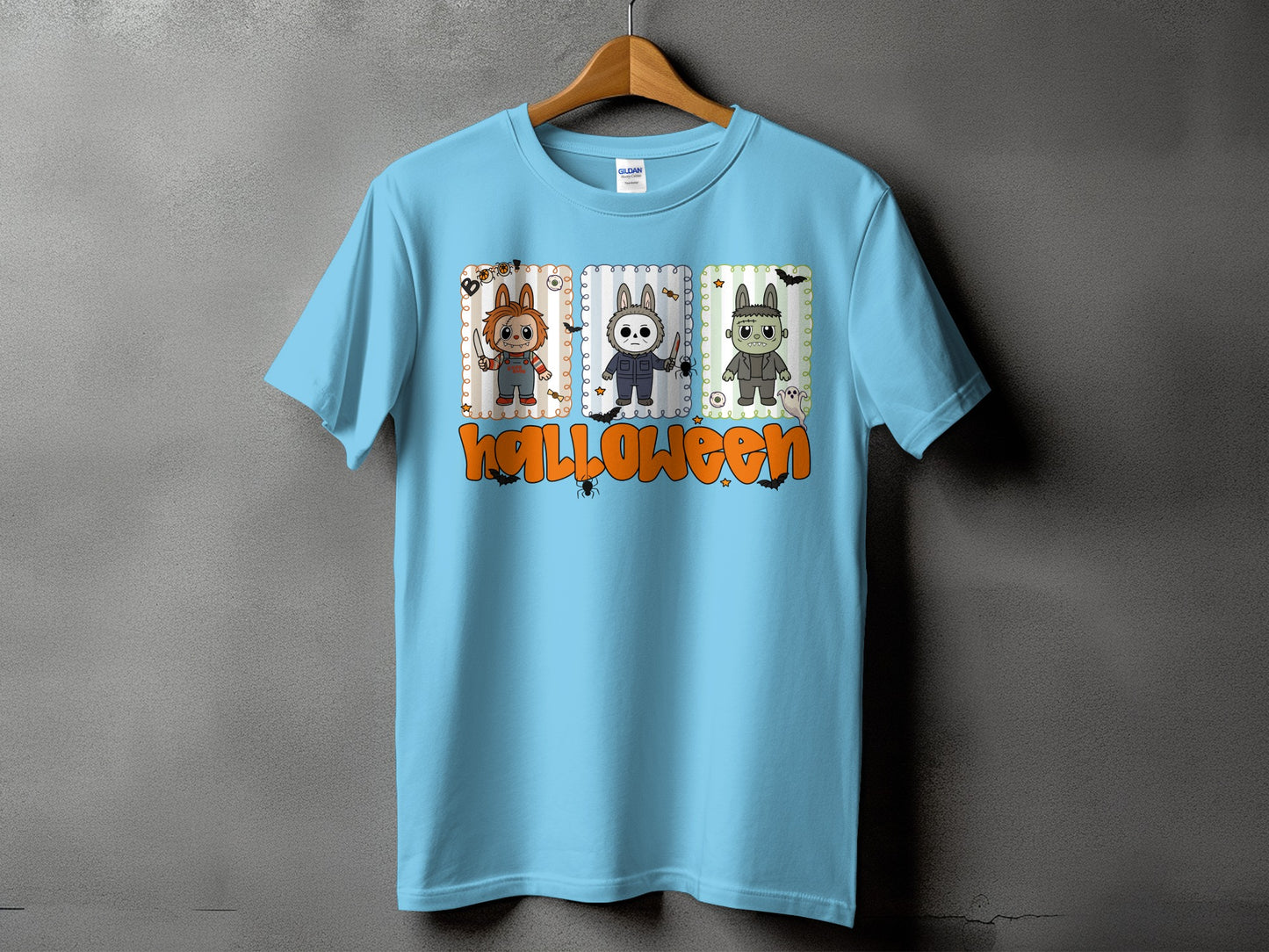 Light blue t-shirt with three cartoon characters and "Halloween" text.