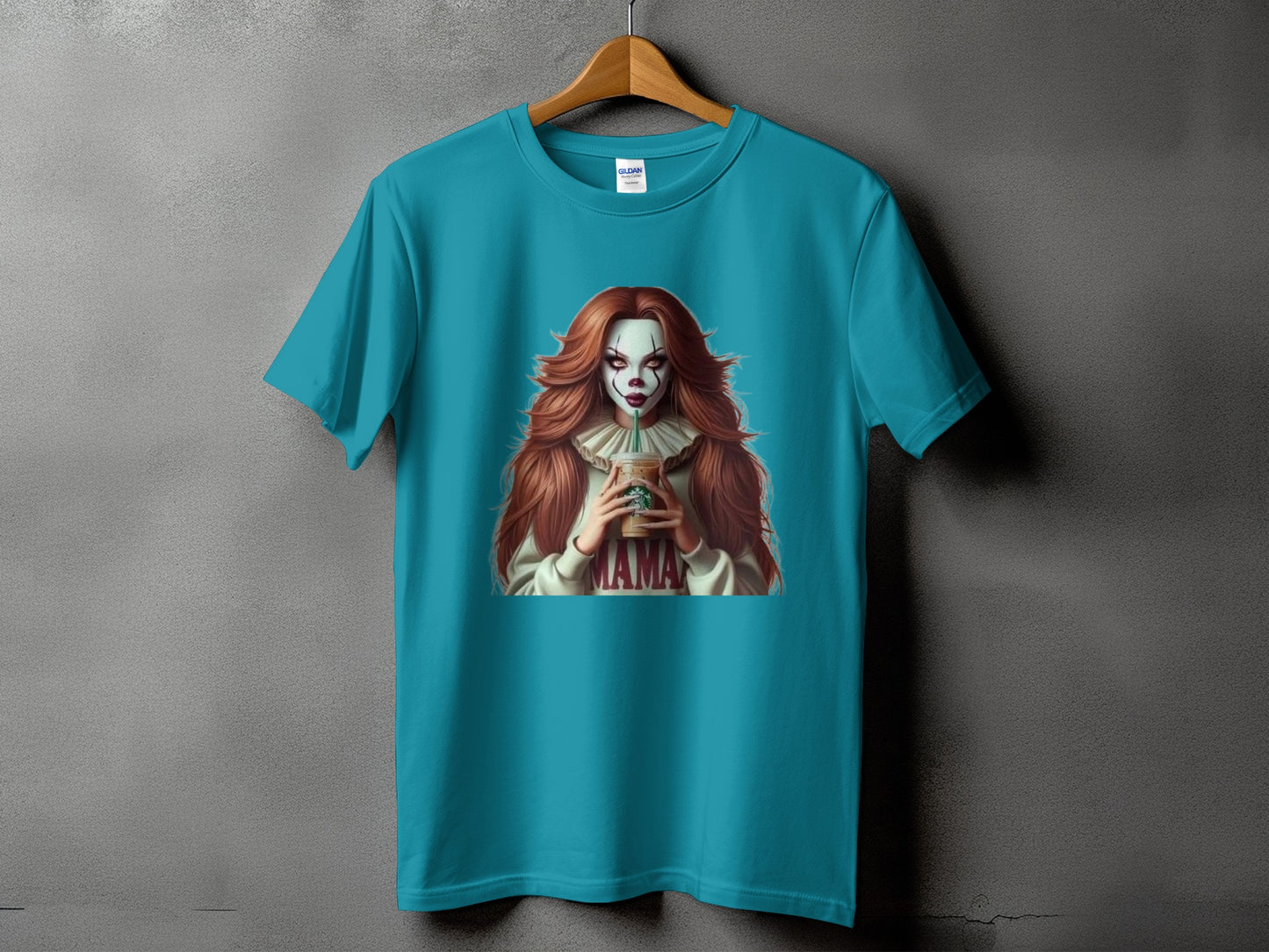 Turquoise t-shirt with graphic of a woman with clown makeup holding a Starbucks cup.