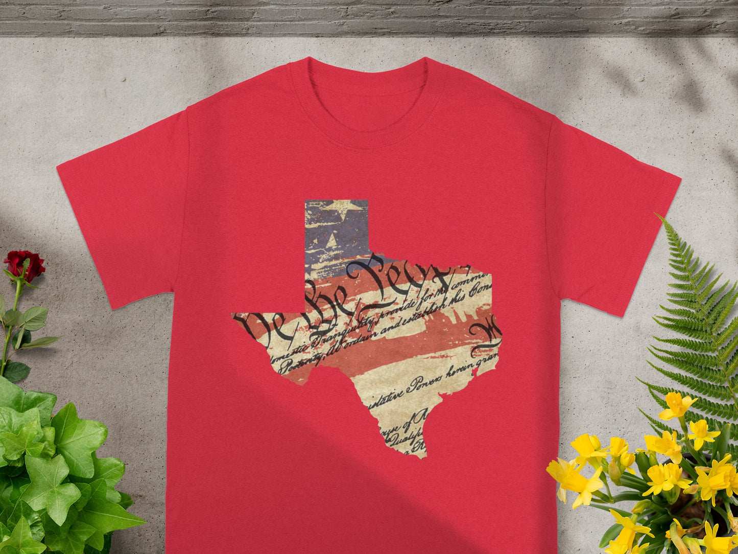 Red t-shirt with Texas outline featuring American flag and historical text.