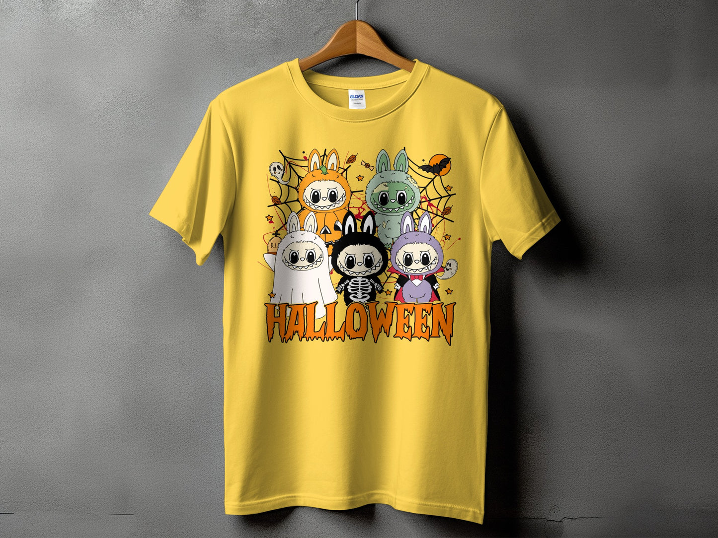 Yellow t-shirt with cartoon Halloween characters and the word "HALLOWEEN".