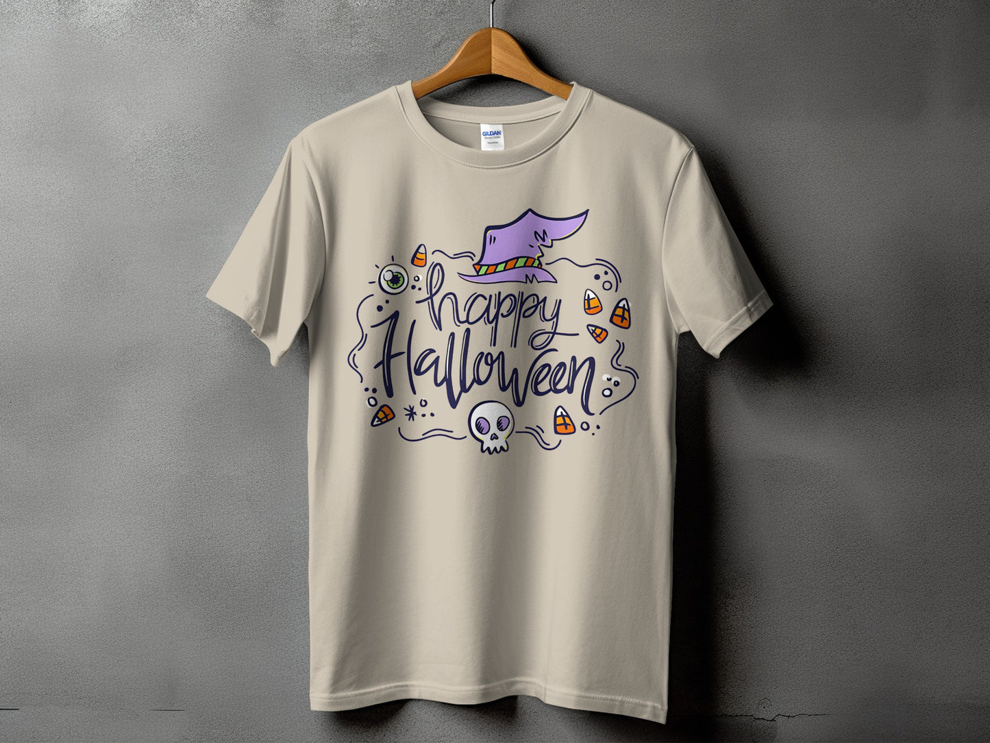 Light beige t-shirt with "Happy Halloween" text, a witch's hat, eye, skull, and candy corn.