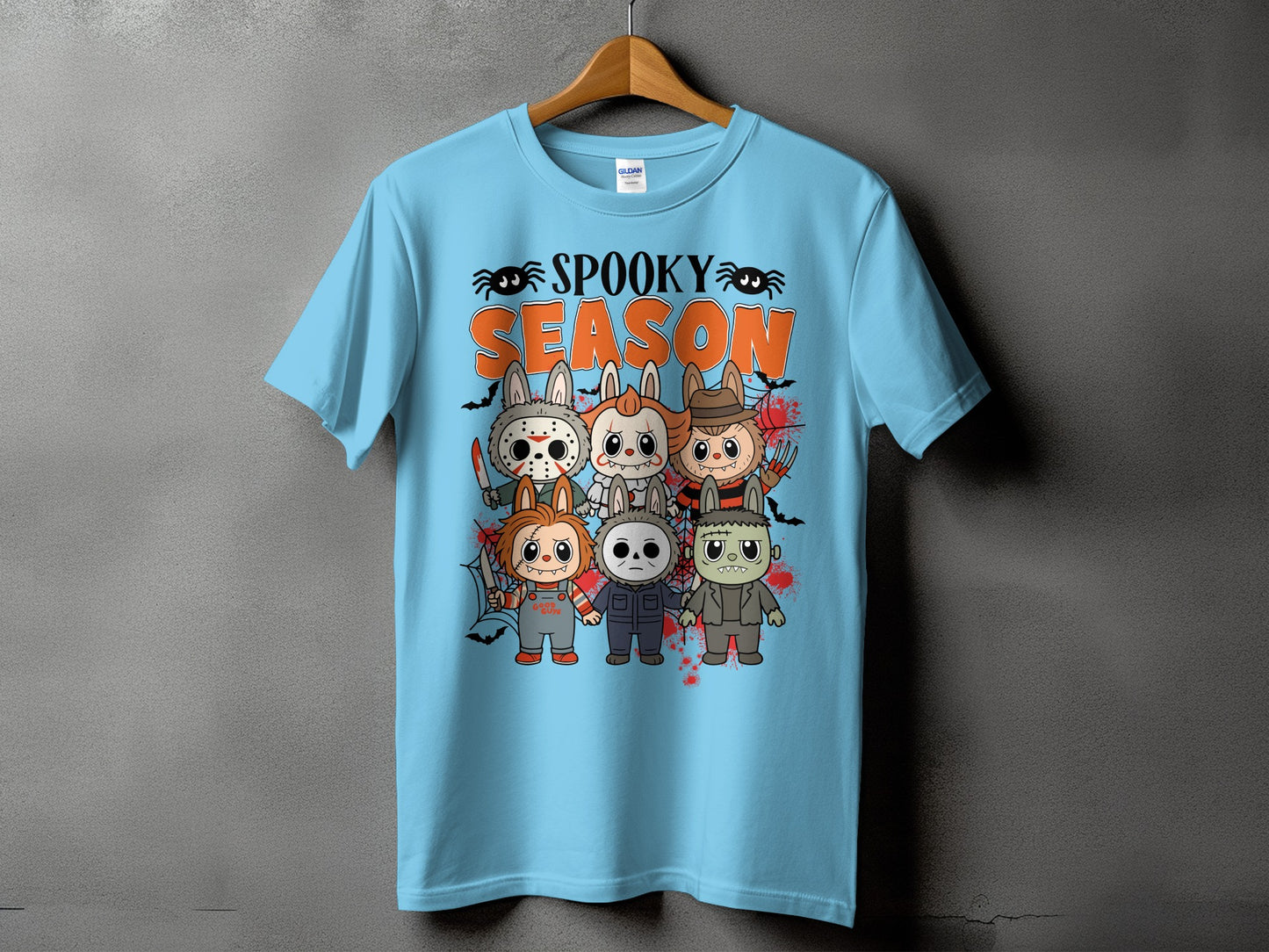 Light blue t-shirt with "Spooky Season" text and cartoon horror characters.