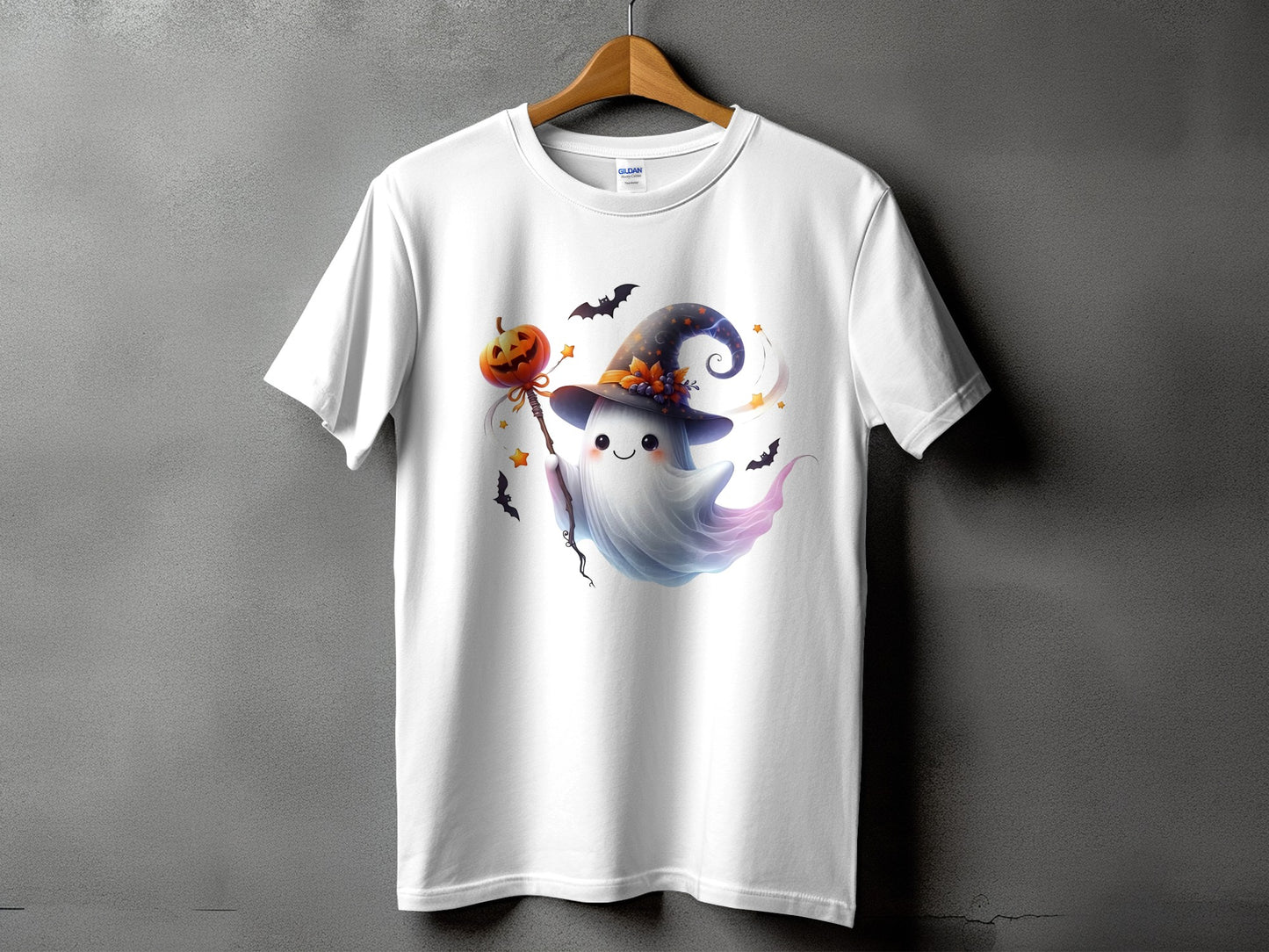 White t-shirt with a cute ghost holding a pumpkin staff and wearing a witch hat.