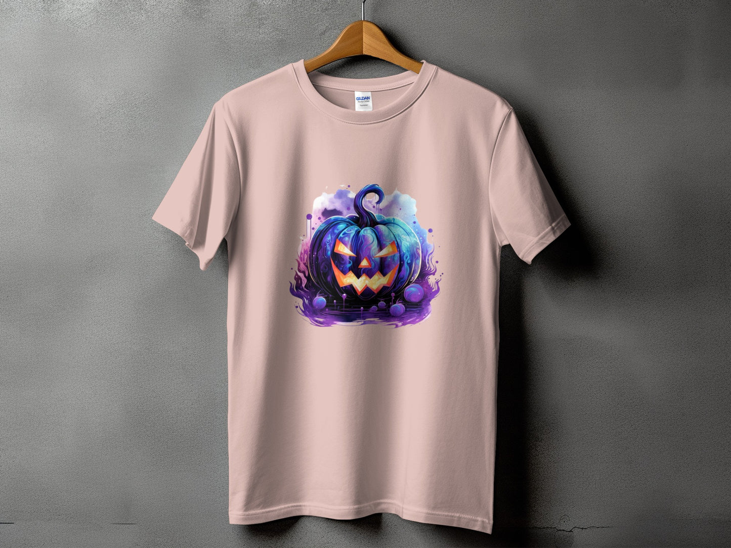 Pink t-shirt with a spooky blue jack-o'-lantern design and purple accents.