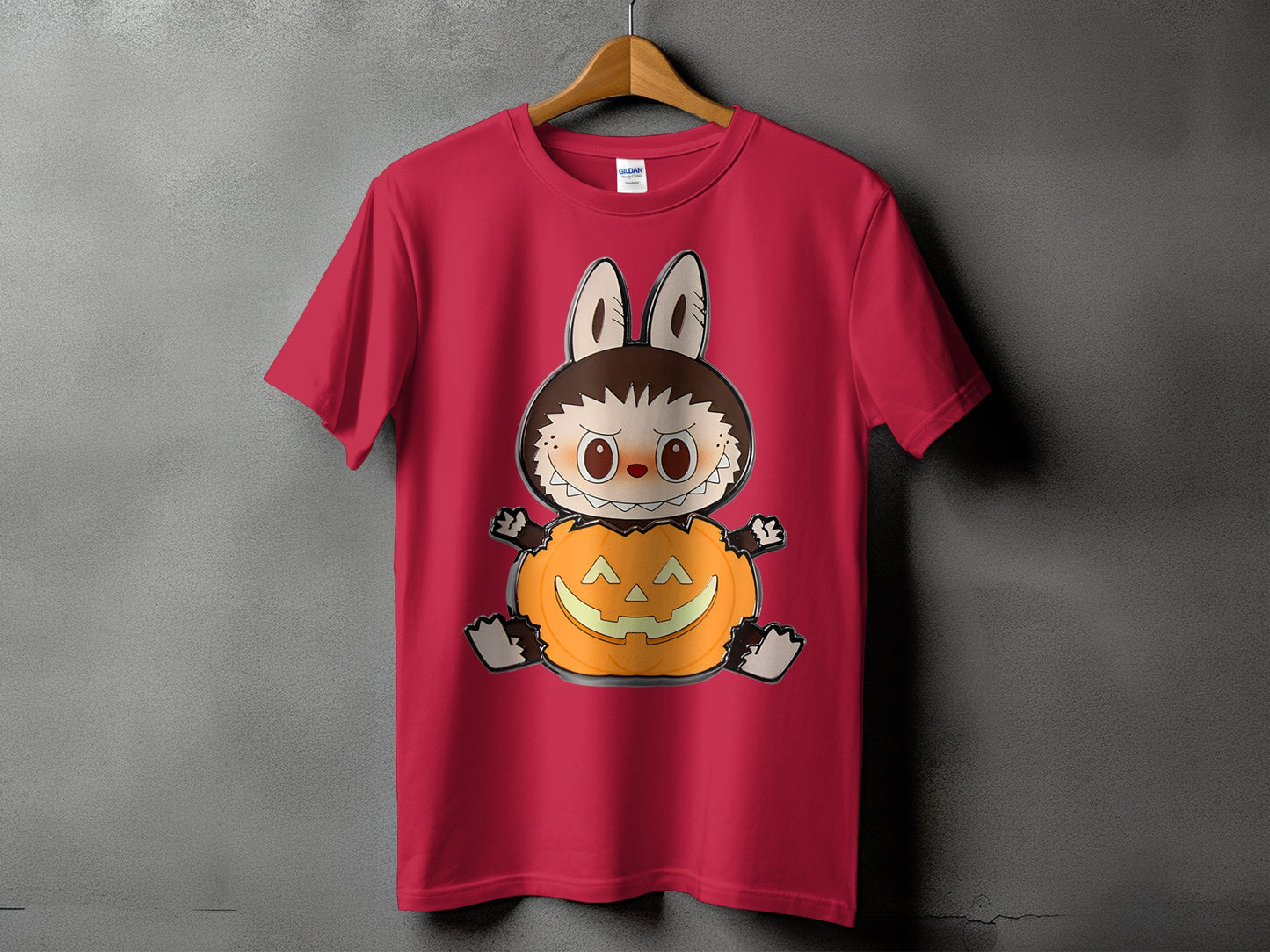 Red t-shirt with a cartoon character sitting in a pumpkin.
