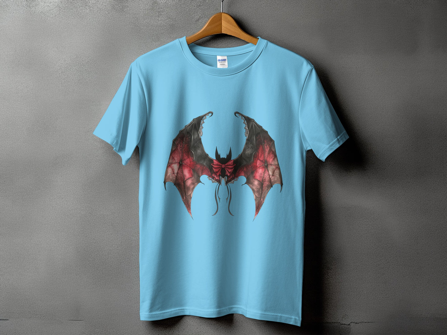 Light blue t-shirt with a large, detailed bat wing graphic in red and black.