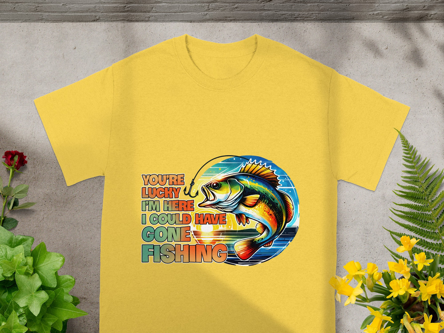 Yellow t-shirt with "You're Lucky I'm Here I Could Have Gone Fishing" text and a fish graphic.