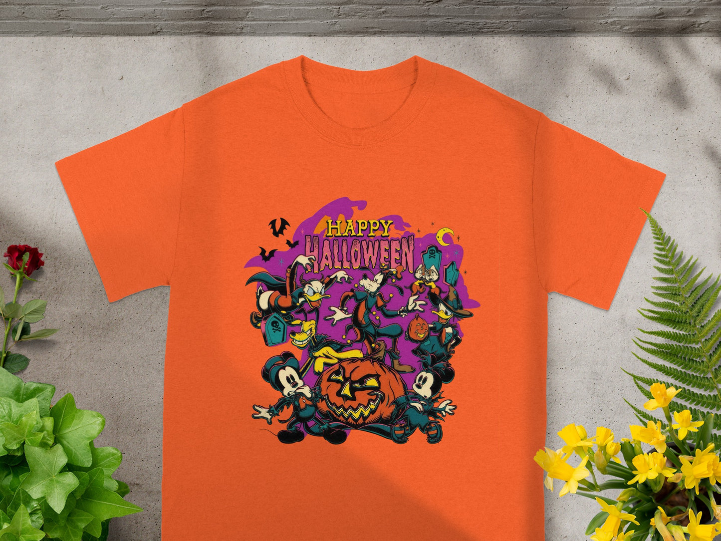 Orange t-shirt with "Happy Halloween" text and Disney characters around a jack-o'-lantern.