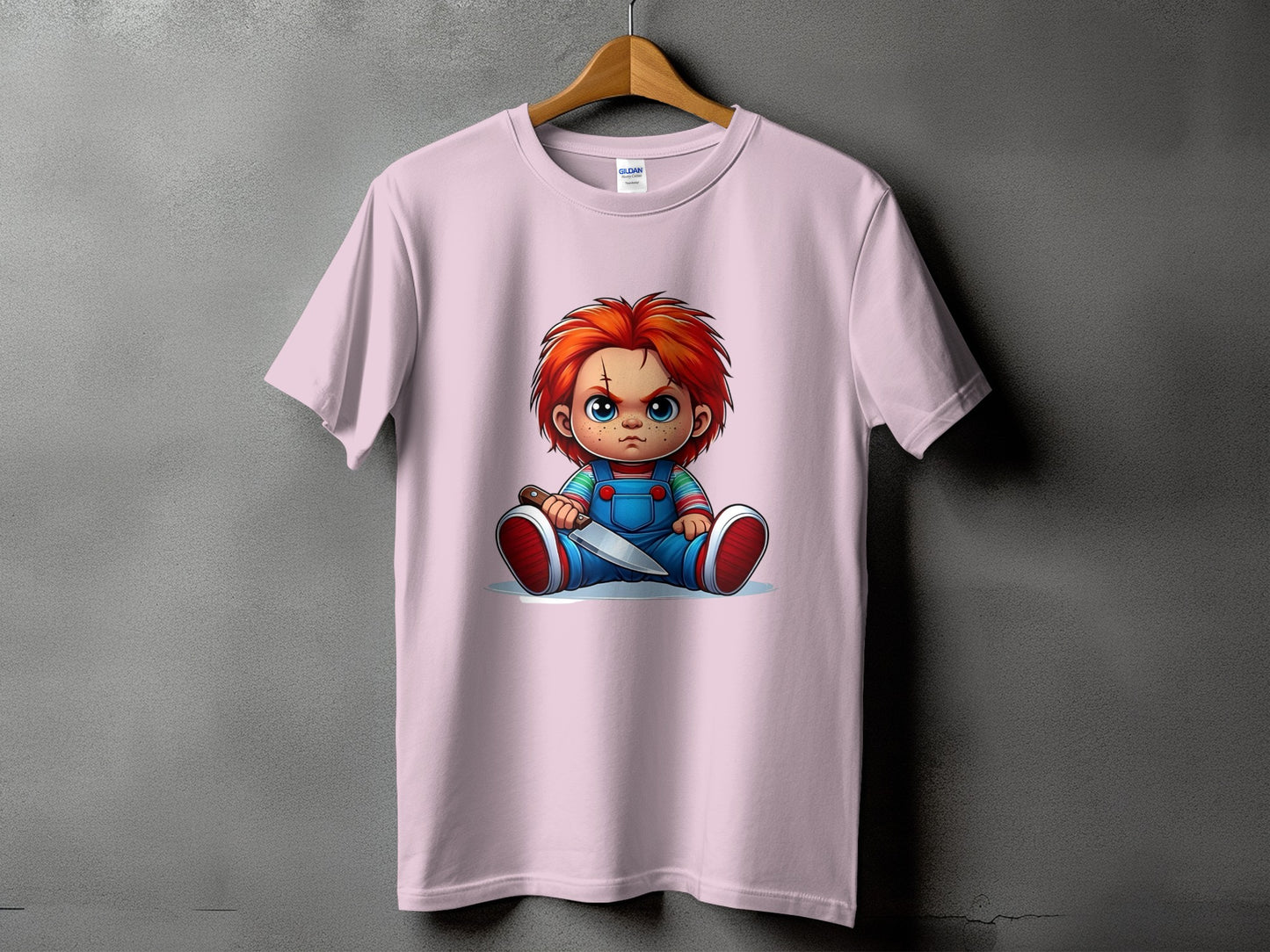 Pink t-shirt featuring Chucky doll holding a knife.