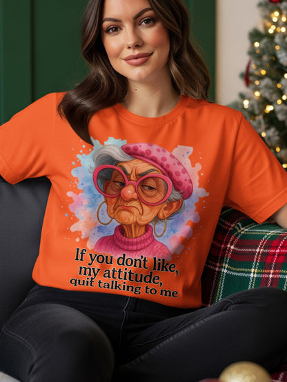 Orange t-shirt with cartoon of grumpy older woman saying "if you don't like, my attitude, quit talking to me".