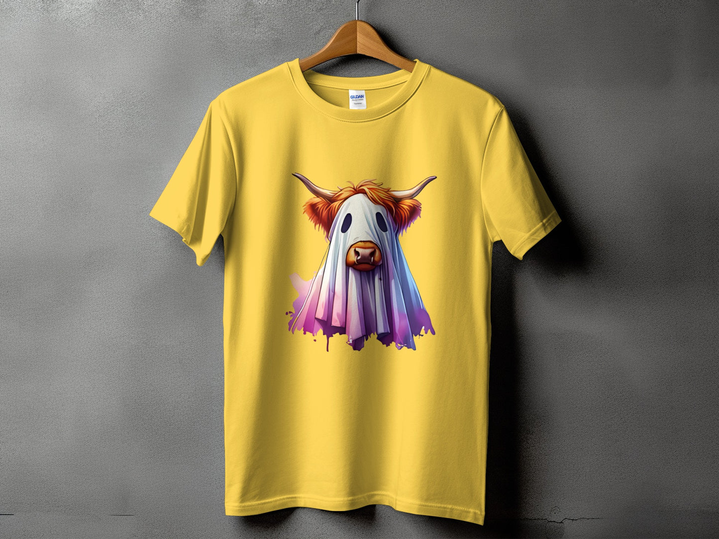 Yellow t-shirt with a Highland cow dressed as a ghost graphic.