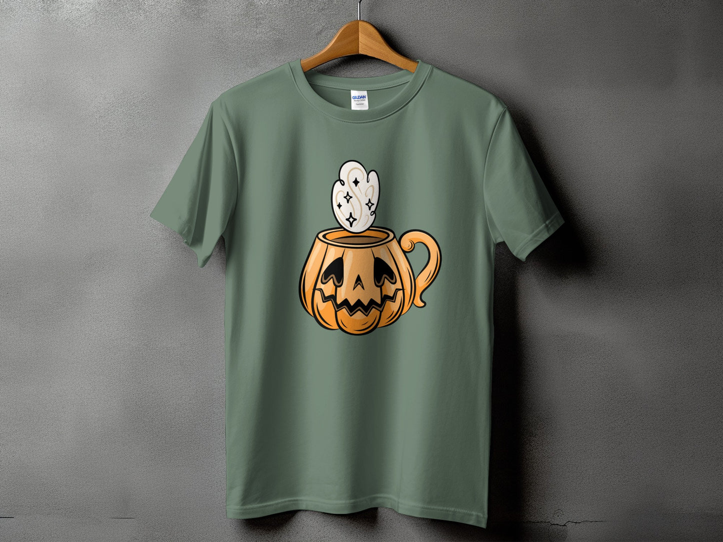 Green t-shirt with jack-o'-lantern mug graphic with steam and sparkles.