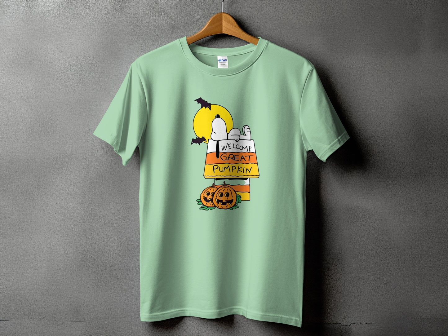 Snoopy on candy corn with pumpkins and text "Welcome Great Pumpkin".