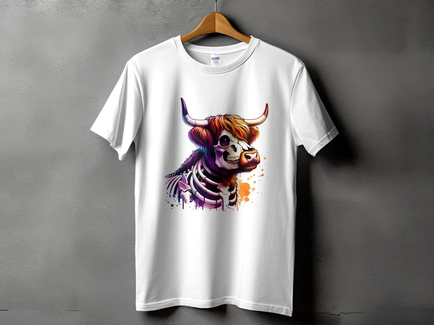 White t-shirt with a colorful skeletal cow graphic and watercolor splatter.