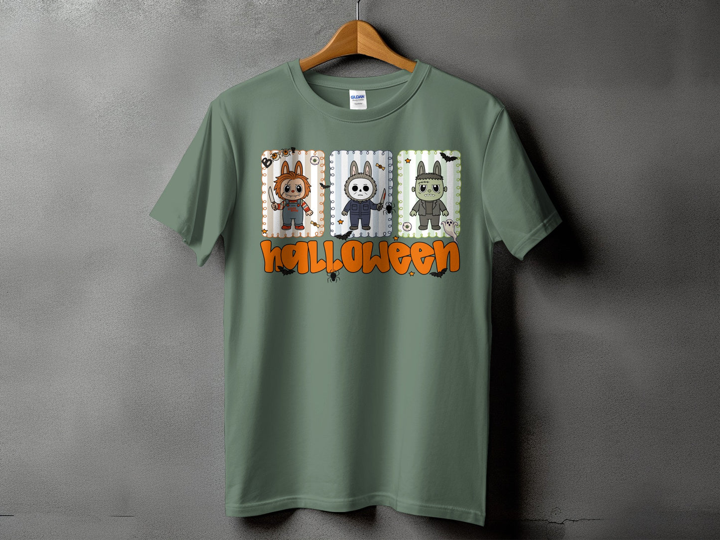 Green t-shirt with Halloween graphic featuring cartoon horror characters and text.