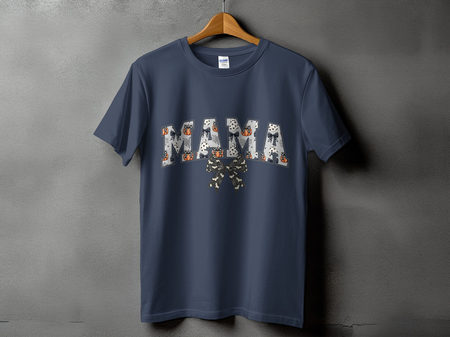 Dark blue t-shirt with "MAMA" in Halloween-themed letters and bow.