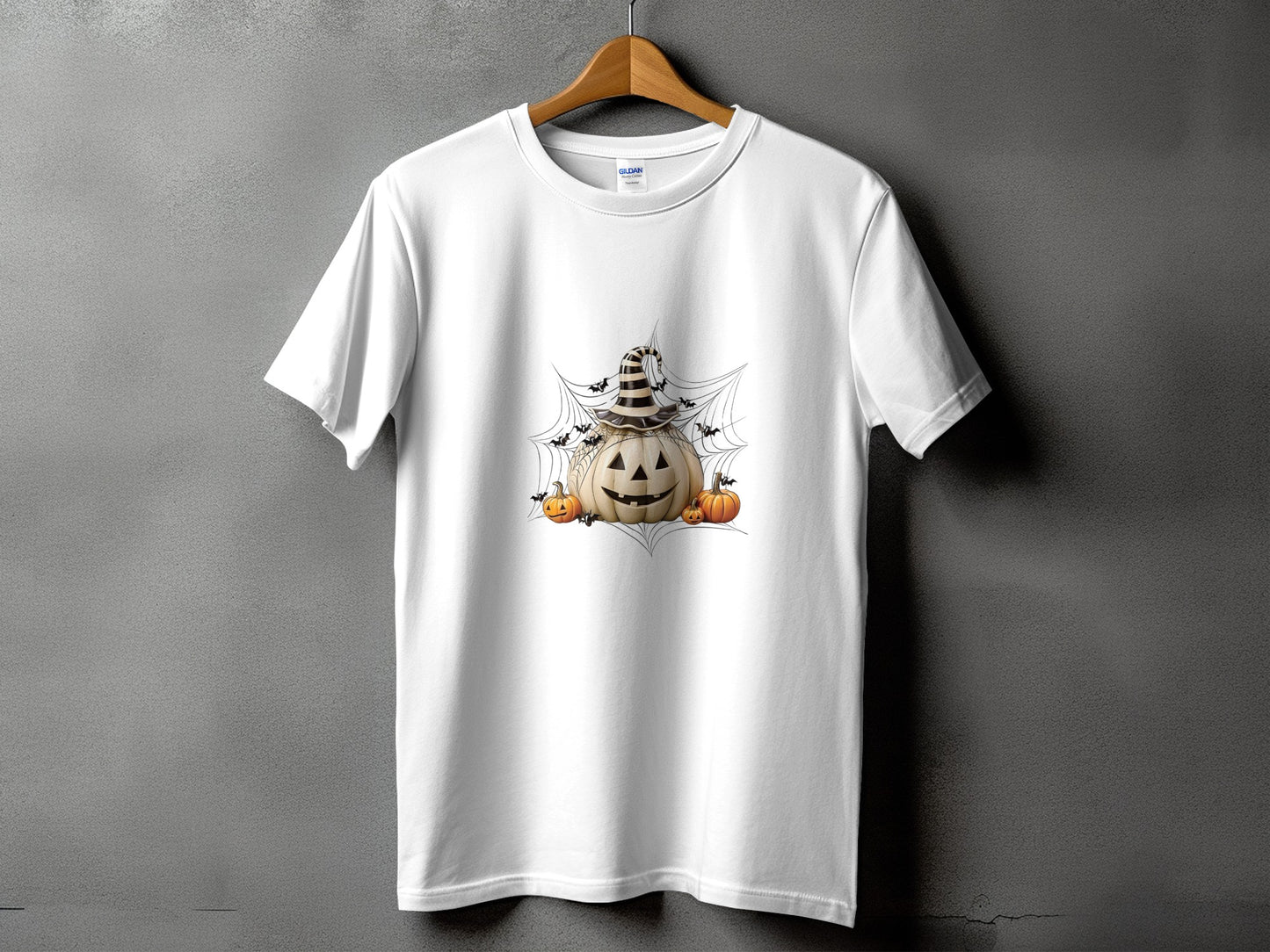 White t-shirt with Halloween graphic of jack-o'-lantern, bats, and spiders on a web.