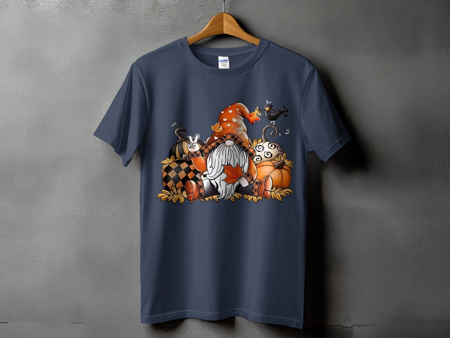Gnome and pumpkins fall-themed graphic on a navy t-shirt.