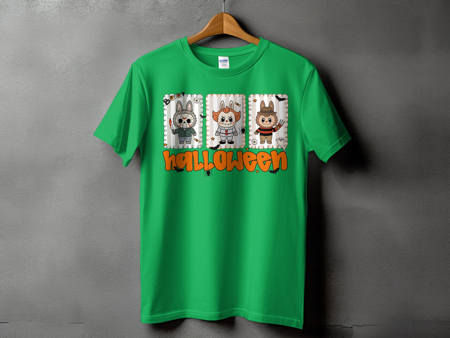 Green t-shirt with three cartoon Halloween characters and the word "Halloween".