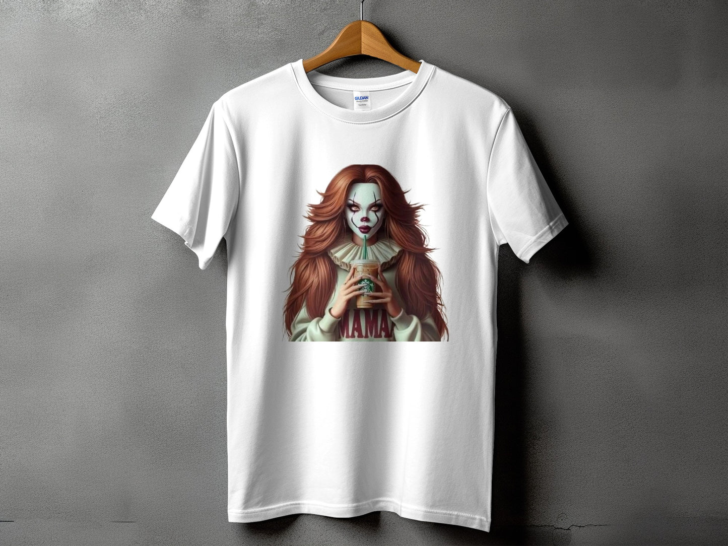 White t-shirt featuring a female clown character holding a Starbucks cup and wearing a "MAMA" sweatshirt.