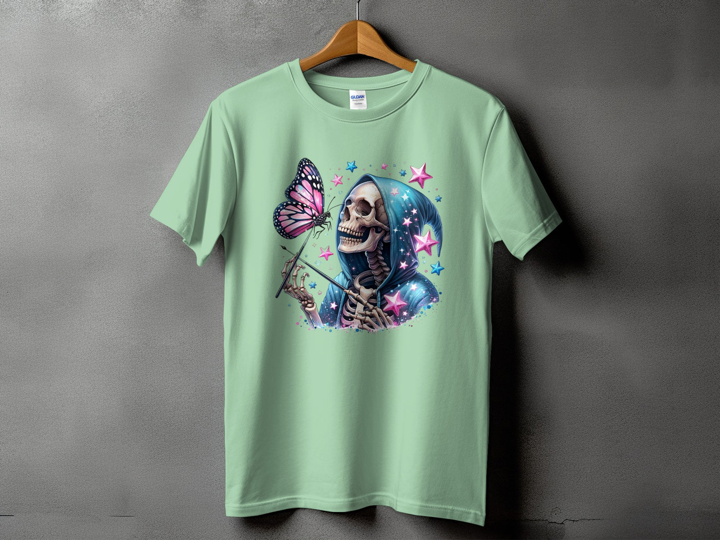 Skeleton with butterfly and stars on a light green t-shirt.