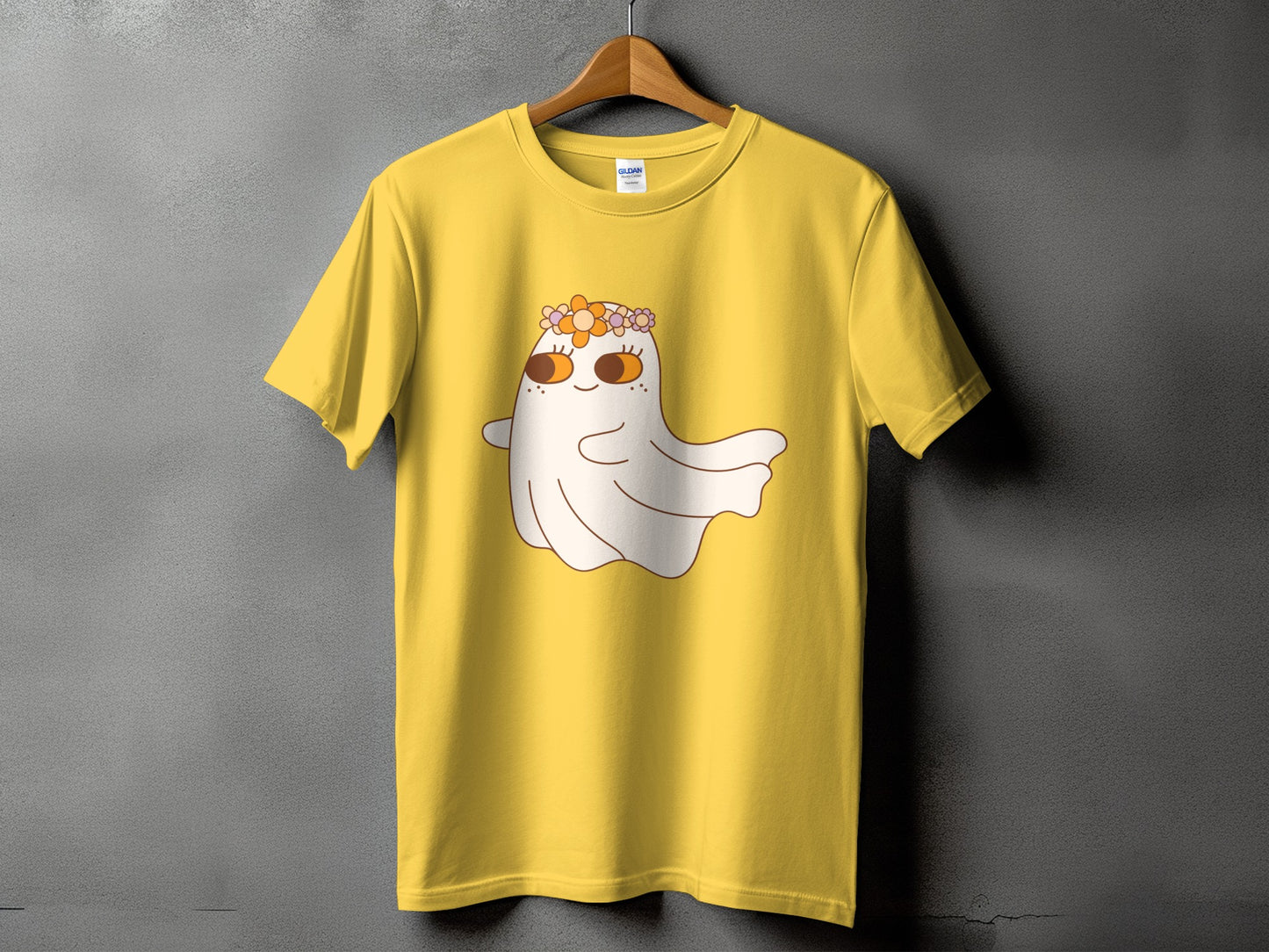 Yellow t-shirt with a cartoon ghost wearing a flower crown and Gildan label.