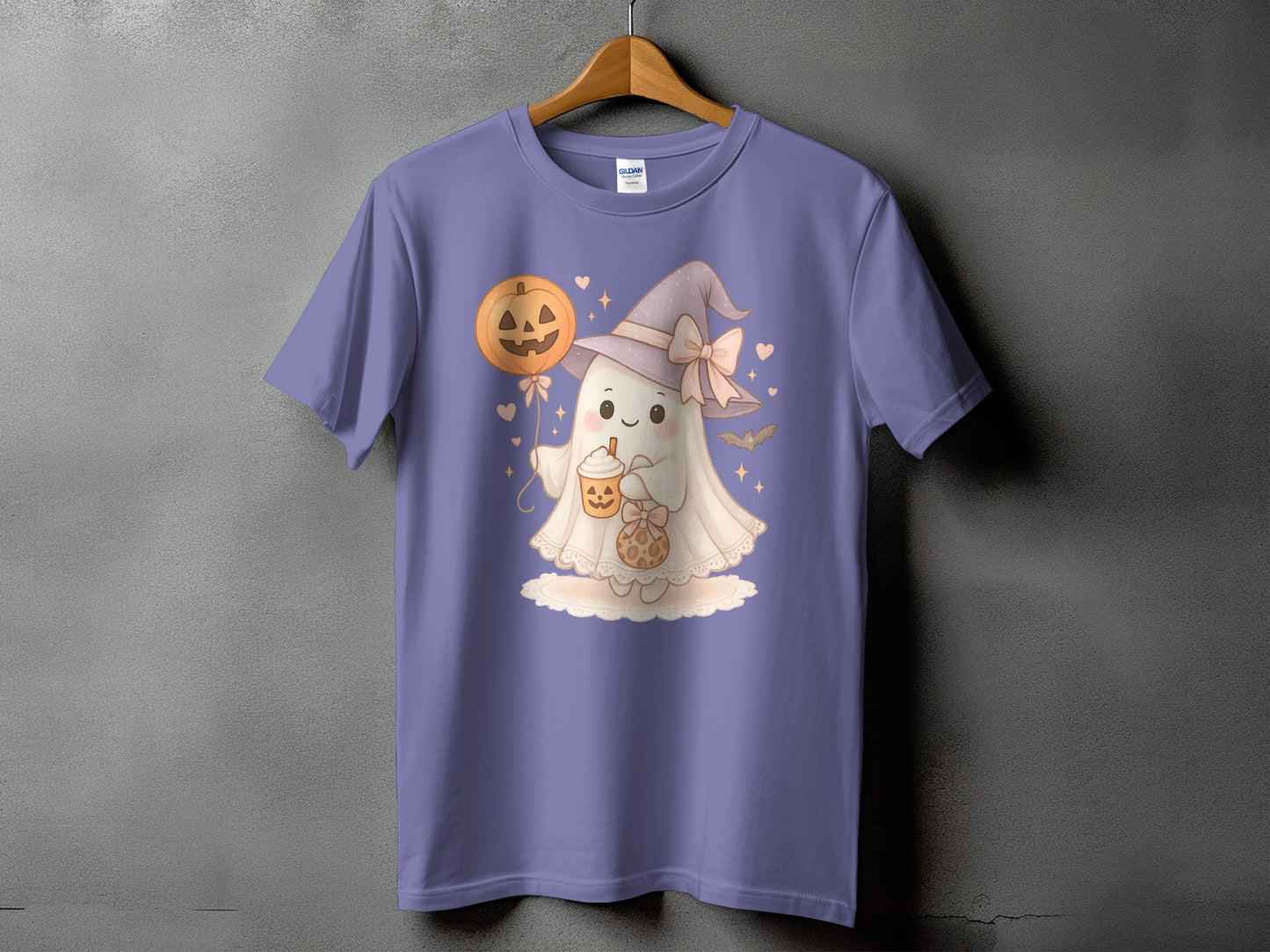 Ghost in witch hat holding pumpkin drink and cookie on purple t-shirt.