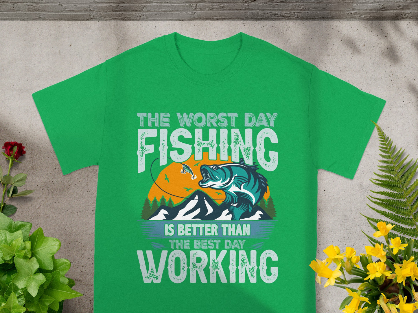 Green t-shirt with "The worst day fishing is better than the best day working" text.