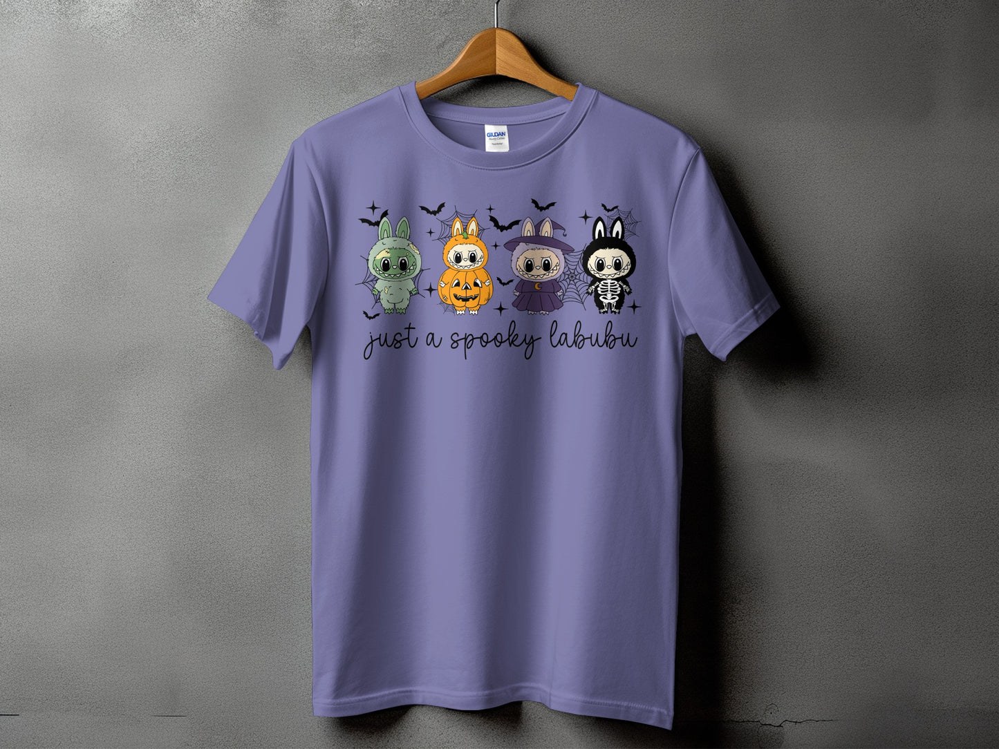 Purple t-shirt with four Halloween-themed labubu characters and the text "just a spooky labubu."