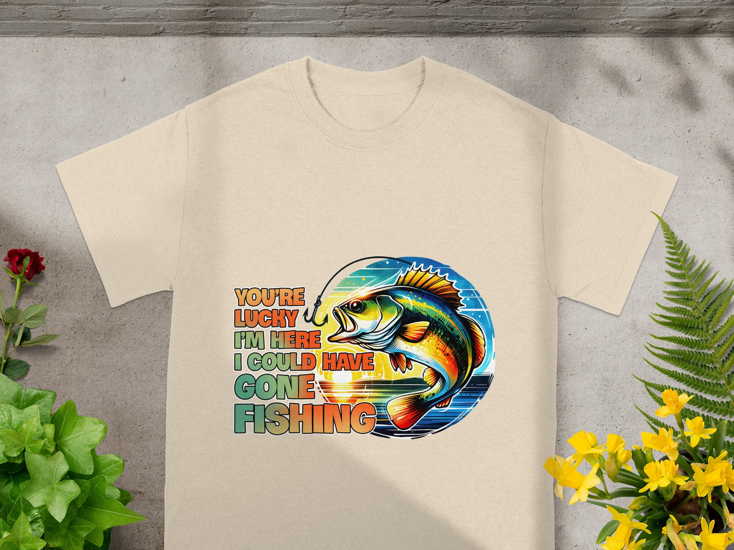 T-shirt with graphic of fish and text "You're lucky I'm here, I could have gone fishing."