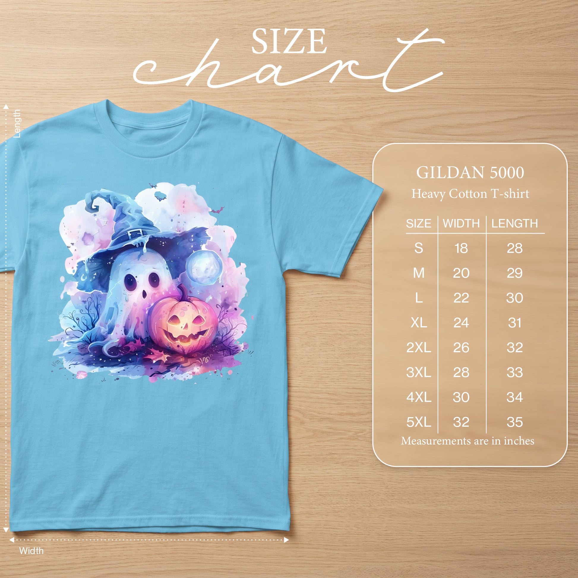Light blue t-shirt with watercolor ghost, pumpkin, and moon Halloween graphic. Size chart included.