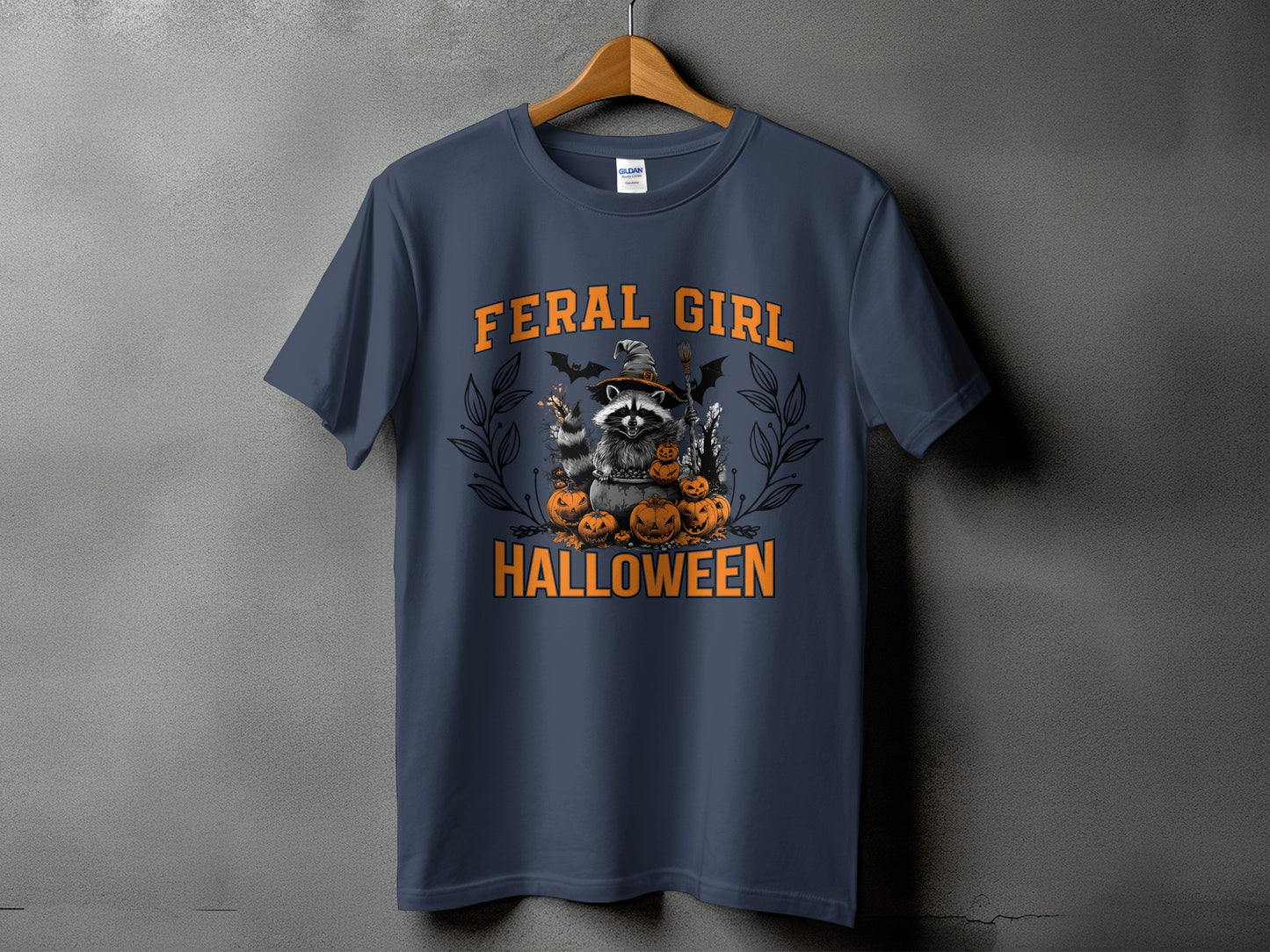 Feral Girl Halloween t-shirt design with raccoon, pumpkins, and bats.