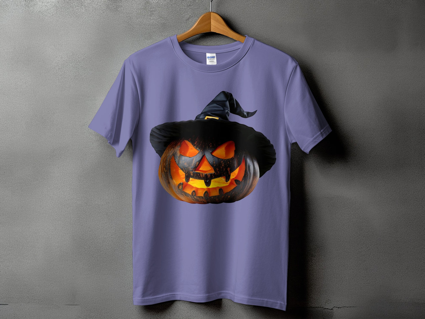 Purple t-shirt with a carved jack-o'-lantern wearing a witch's hat.
