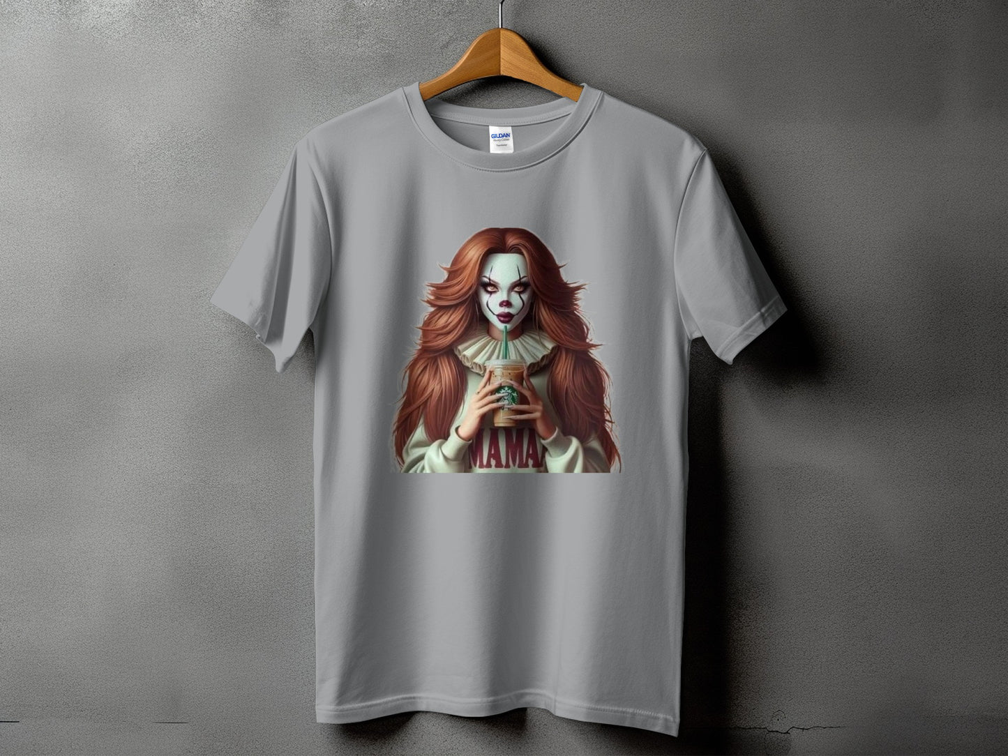 Grey t-shirt with graphic of a clown holding a Starbucks cup, text "MAMA" visible.